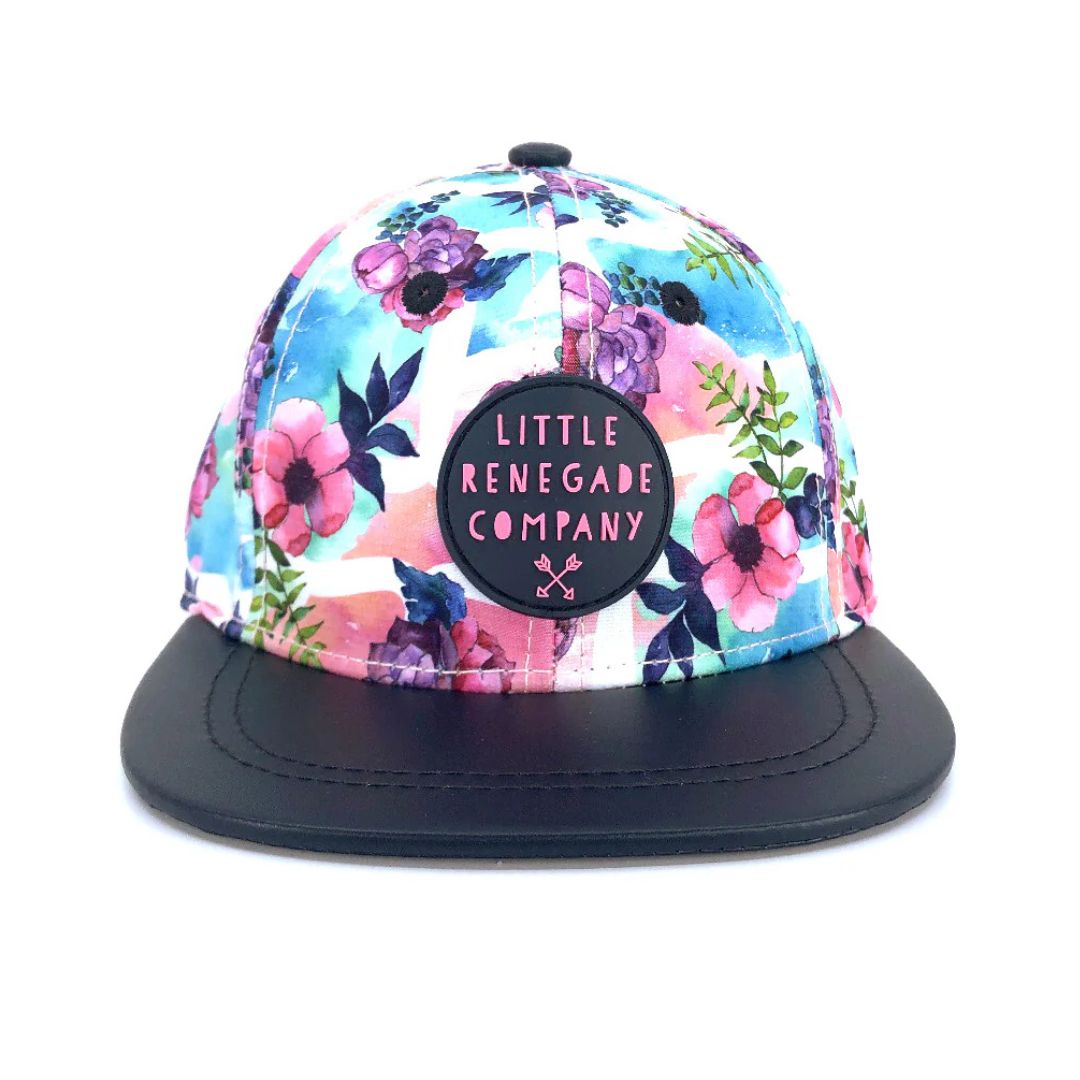 Pastel watercolour floral baby snapback cap with pink Little Renegade Company badge and navy peak