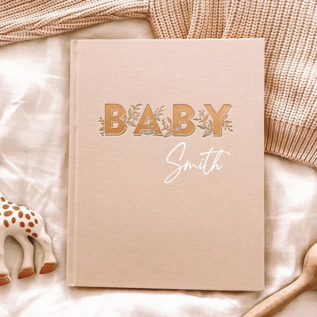Personalised baby memory book in buttermilk for recording baby's milestones
