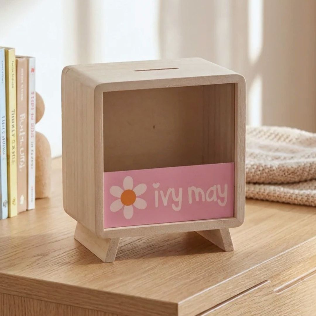 Personalised wooden money box for girls with pink daisy design