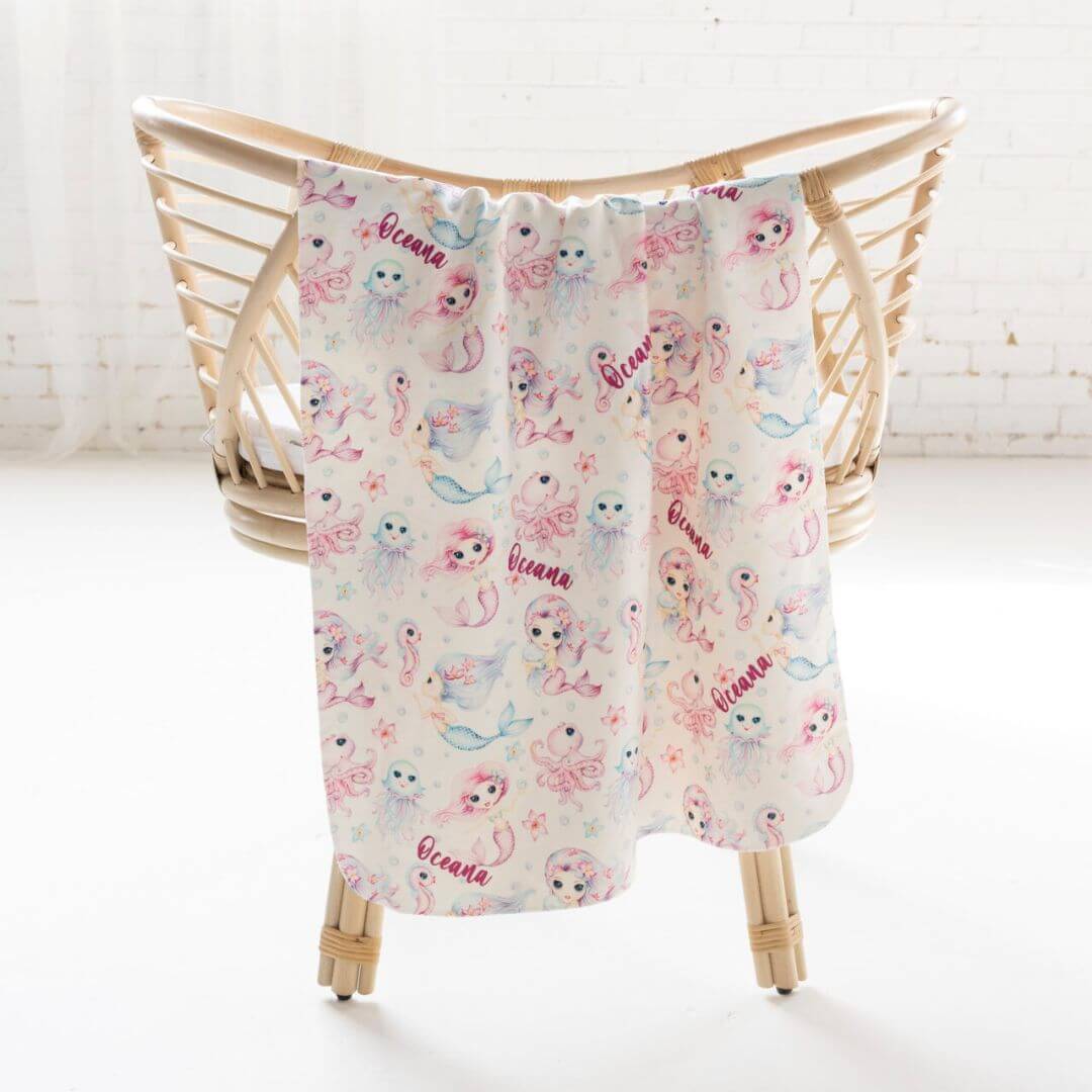 Jersey swaddle wrap with pink and blue mermaid print and personalised name