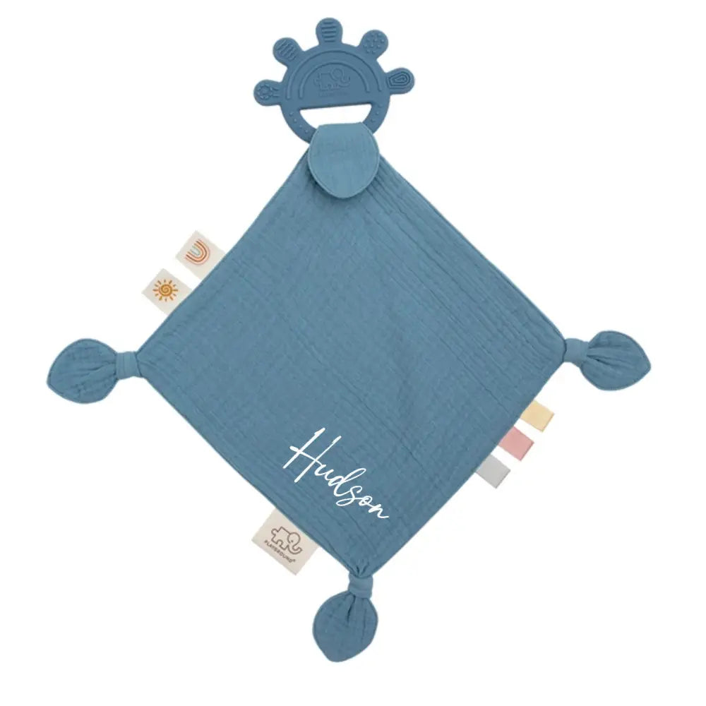 Personalised silicone comfort teether in steel blue with soft muslin, perfect baby gift for soothing teething babies.