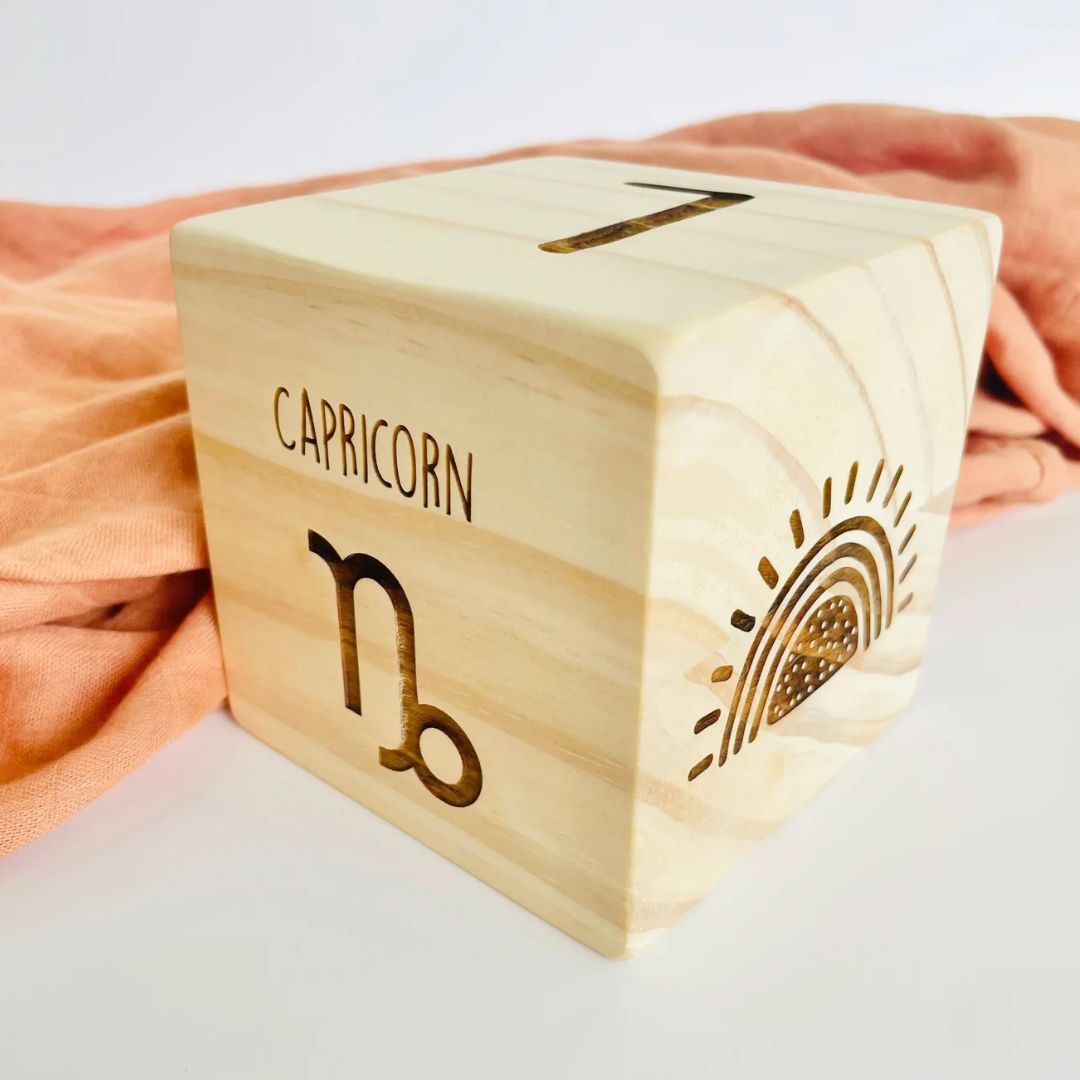 Wooden block engraved with baby's star sign and birth details