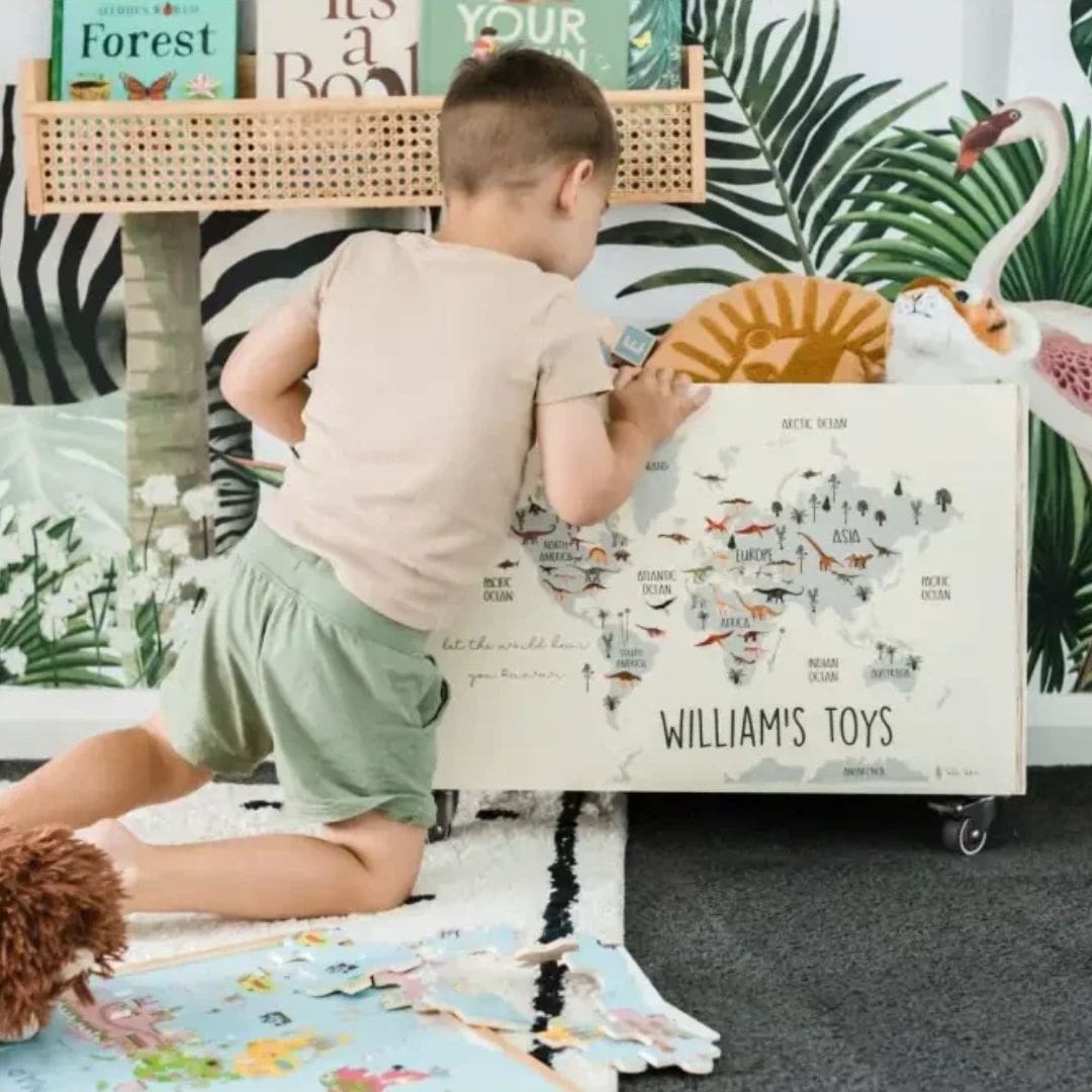 Child organising toys in a Personalised Wooden Toy Box