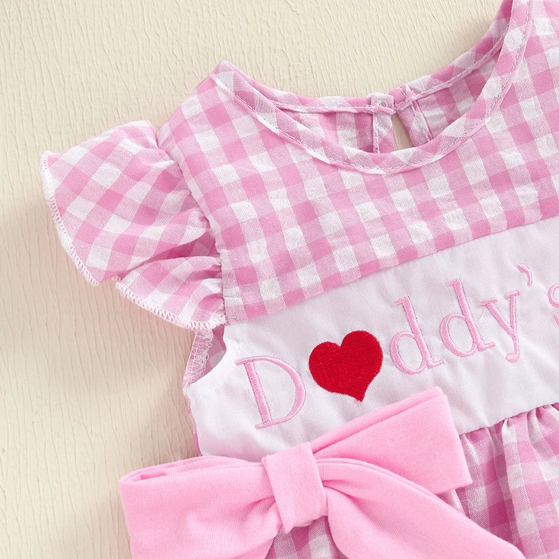 Close-up of Daddy's Girl pink gingham romper featuring flutter sleeves and embroidered text