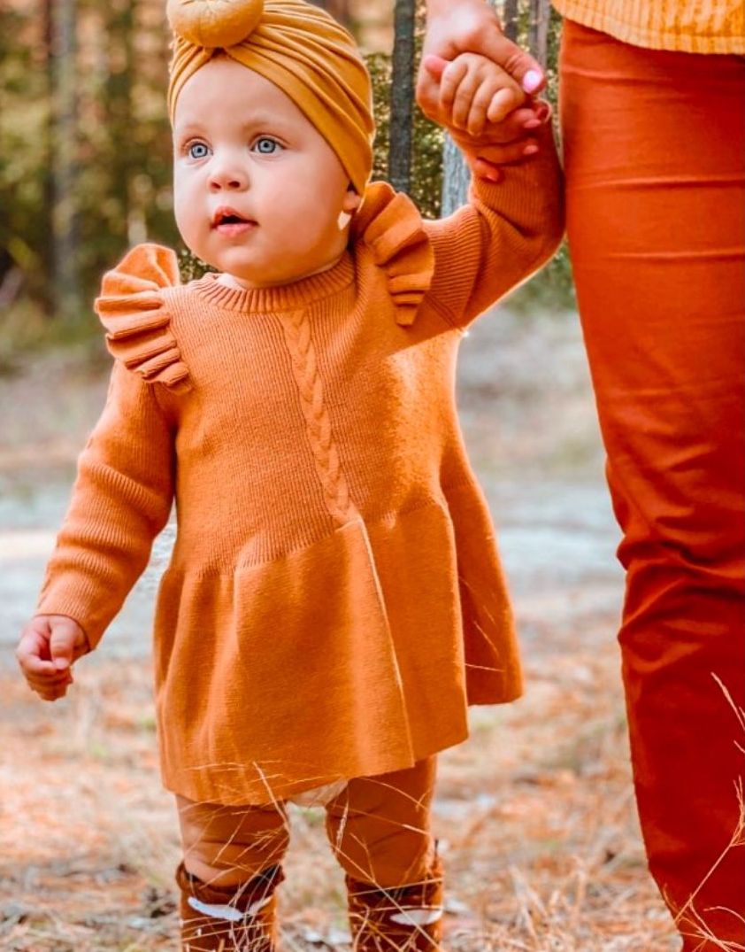 Baby girl wearing Poppy Winter Knit Dress in cinnamon from Lulu Babe