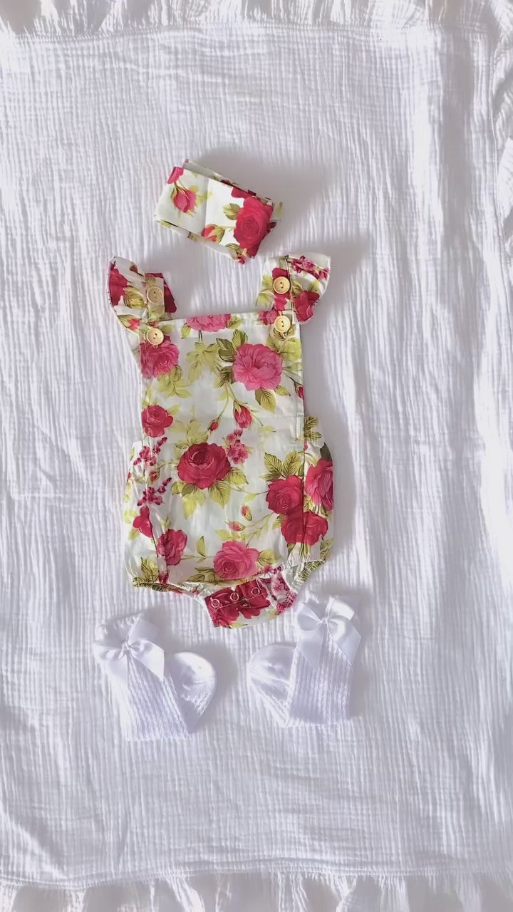 Video of baby girl wearing Ava Floral Baby Romper from Lulu Babe