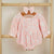 Boho Baby Girl Romper in pink with floral print and puff sleeves, perfect baby girl outfit for a stylish look.
