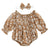 Tan floral baby romper for girls with puff sleeves, perfect boho style outfit for playdates or gatherings.