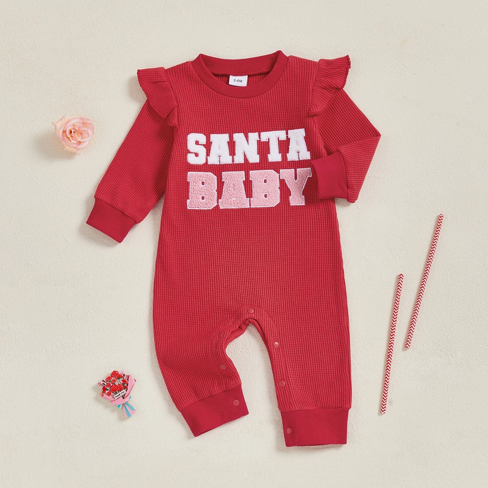 Santa Baby long sleeve Christmas romper for baby girls, featuring ruffle shoulders and festive red design.