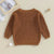 Matching sibling knitted jumper in brown - flatlay showing back view