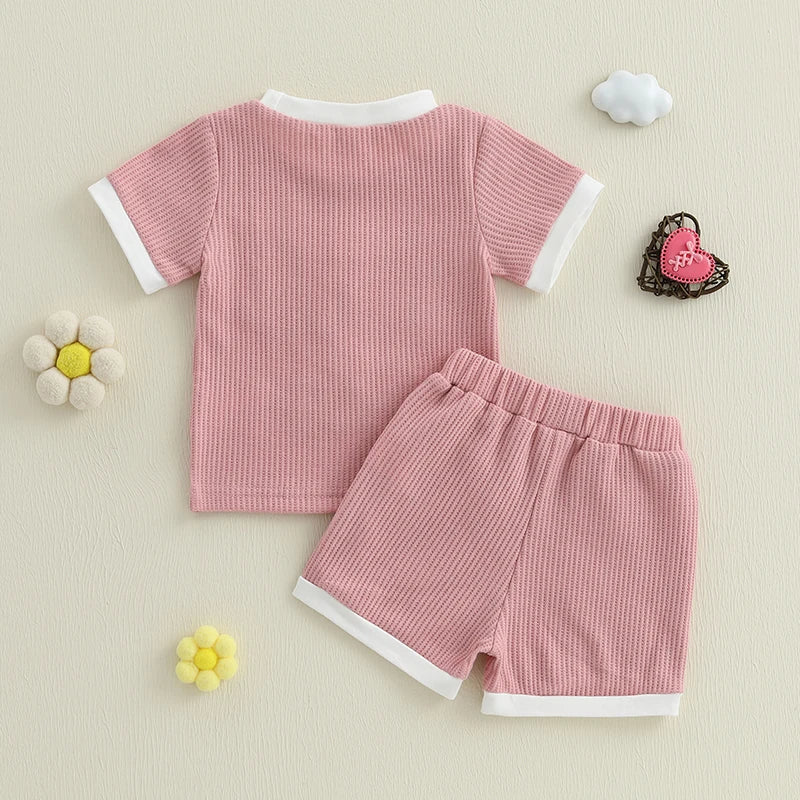 Back view of matching sister pink shorts outfit