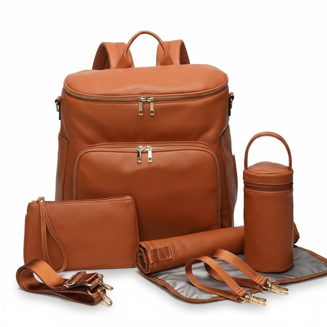 Stylish nappy bag backpack in tan vegan leather with included accessories 