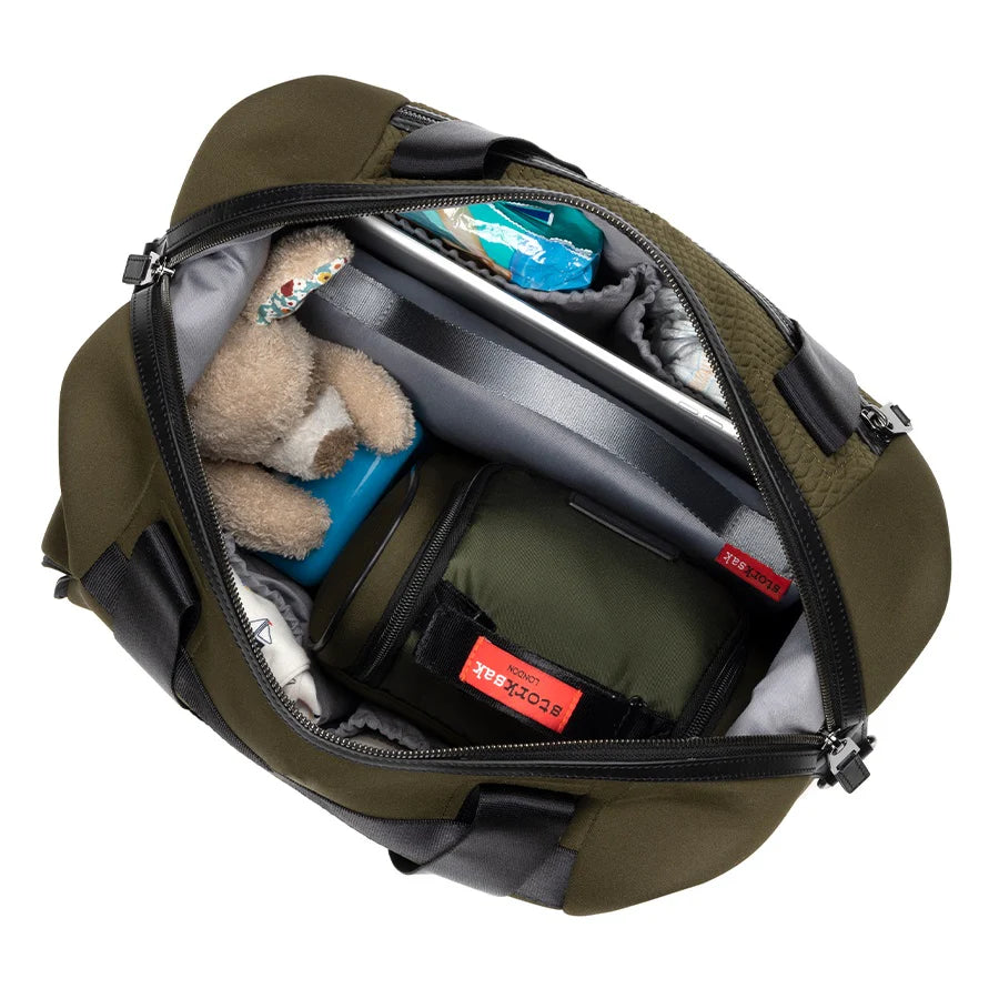 Storksak Stevie Luxe Nappy Bag interior showing organised interior with multiple pockets