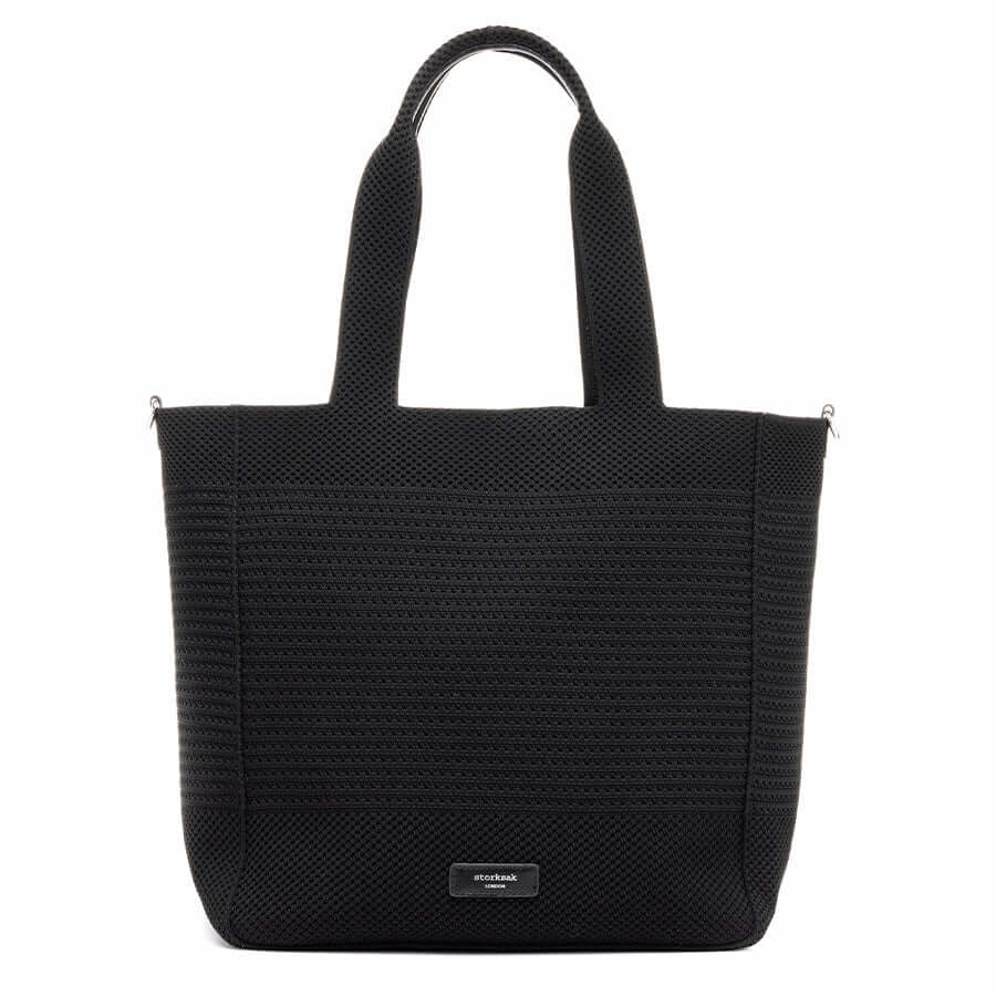Storksak Thea Tote bag in black with woven design, perfect for parents seeking style and practicality.