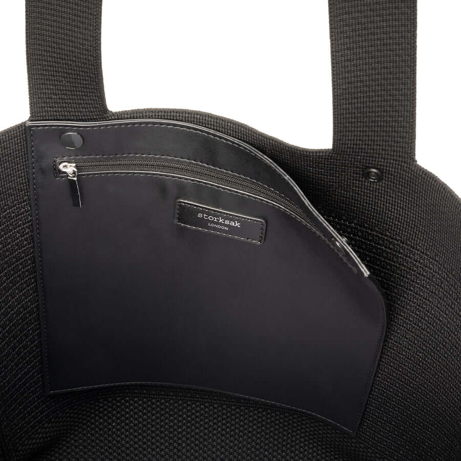 Interior pocket of Storksak Thea Tote showcasing sleek design and functional storage.