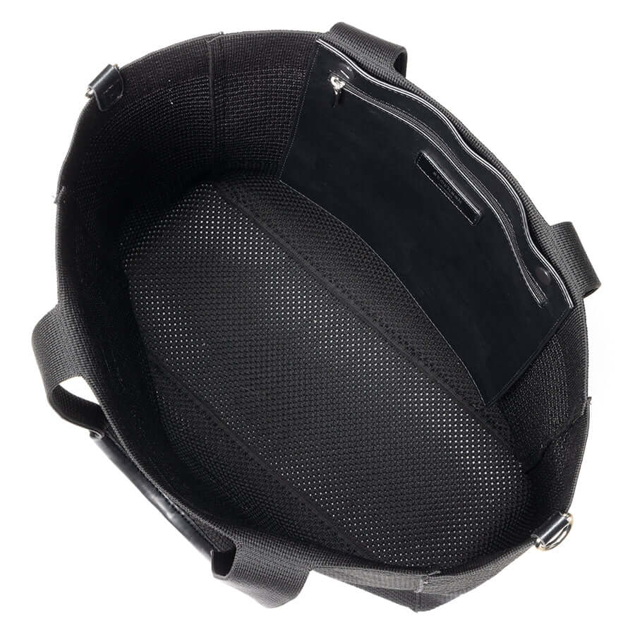 Inside view of the Storksak Thea Tote showcasing its woven design and spacious interior.