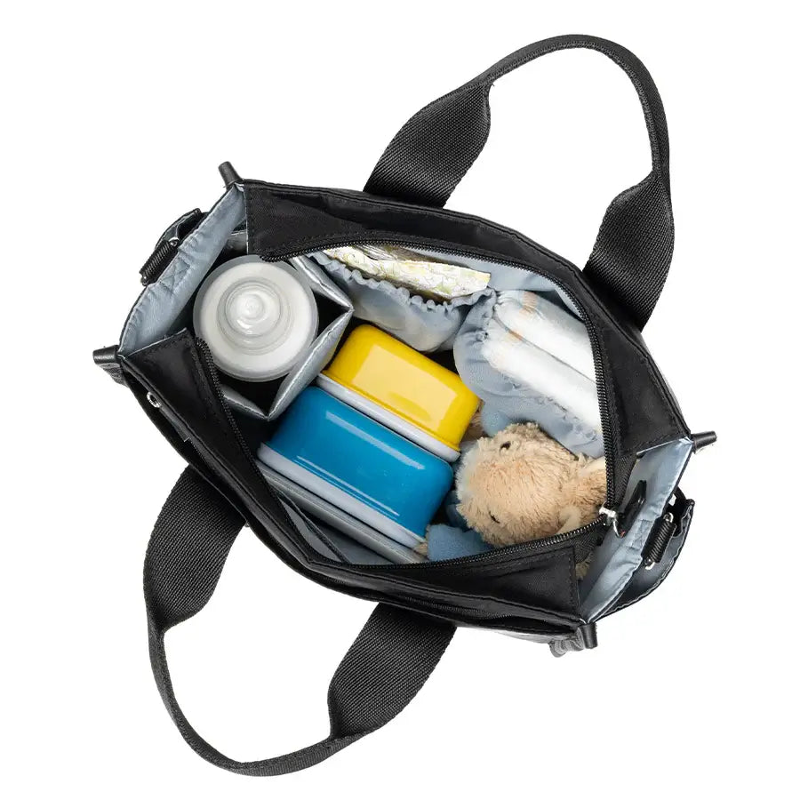 Storksak Thea Tote bag open, packed with nappies and baby essentials