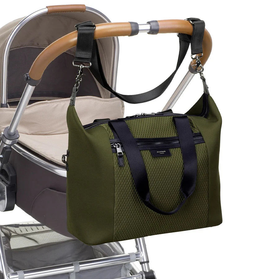 Storksak Stevie Luxe Nappy Bag stylishly attached to stroller handle