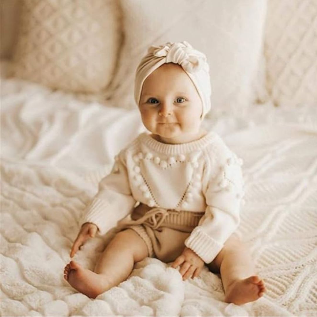 Baby girl wearing knit hear baby girl romper in beige & cream - Lulu Babe