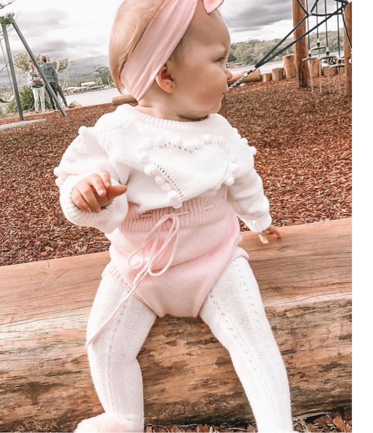 Baby girl wearing knit hear baby girl romper in pink & white, with long sleeves - Lulu Babe