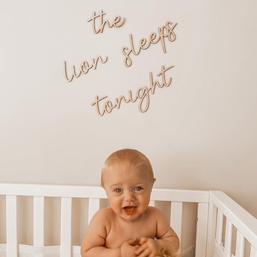 "the lion sleeps tonight" wooden wall sign for nursery, hung above baby's cot