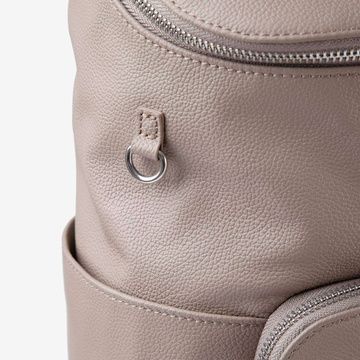 Close-up of the D-ring for attaching accessories on the Frankie leather backpack