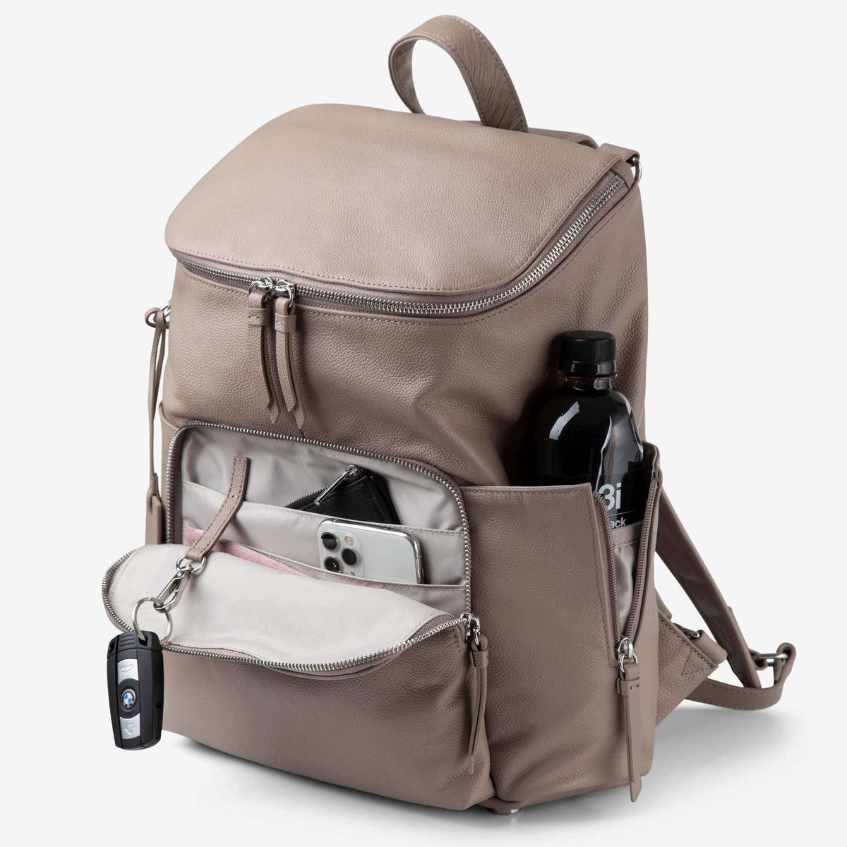 Frankie nappy backpack front pocket open, with phone, keys on the key clip and a bottle in the side pocket