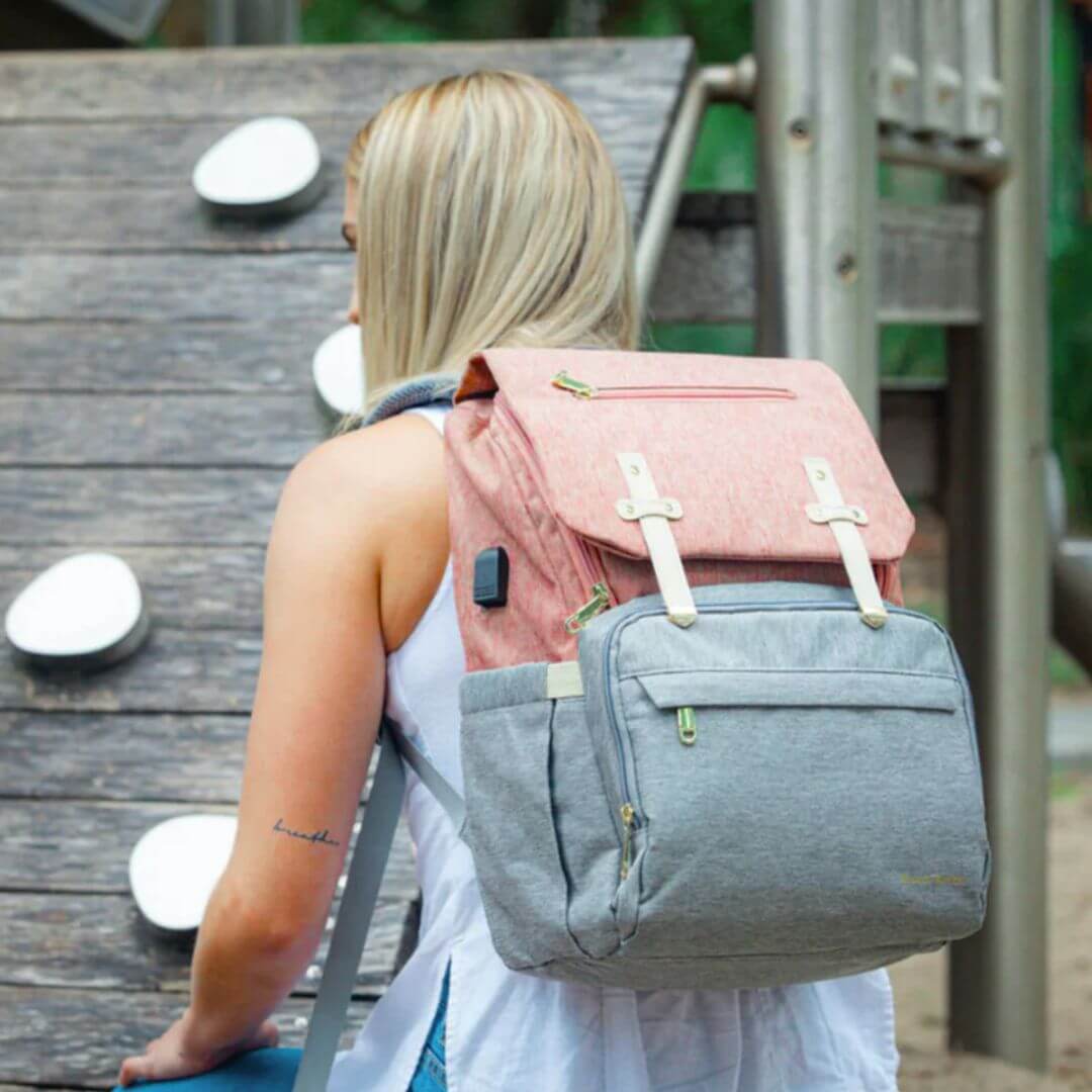 Mum wearing Vienna Nappy Backpack in Pink and Grey