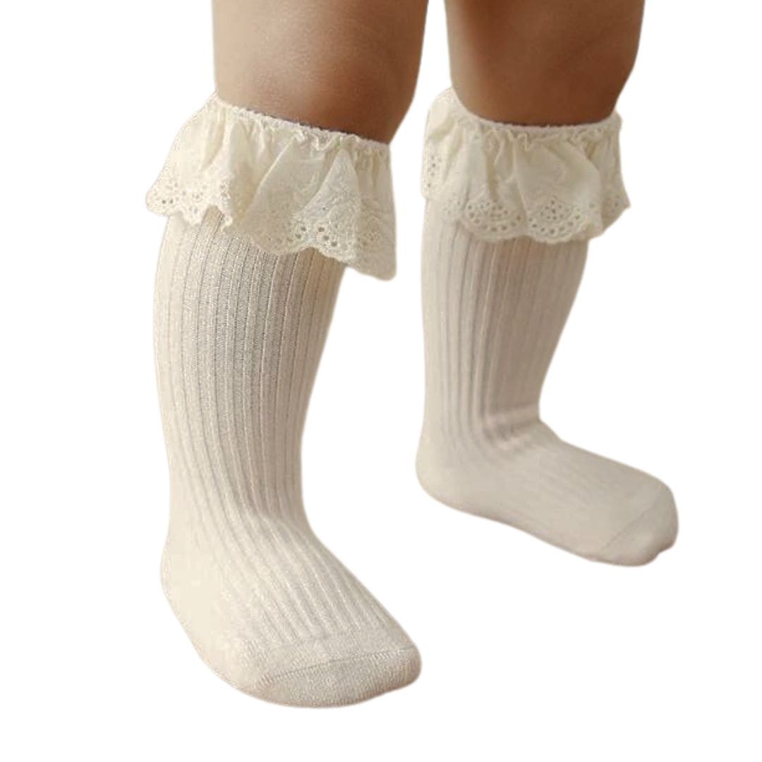 Beige ribbed baby socks with delicate lace ruffle trim