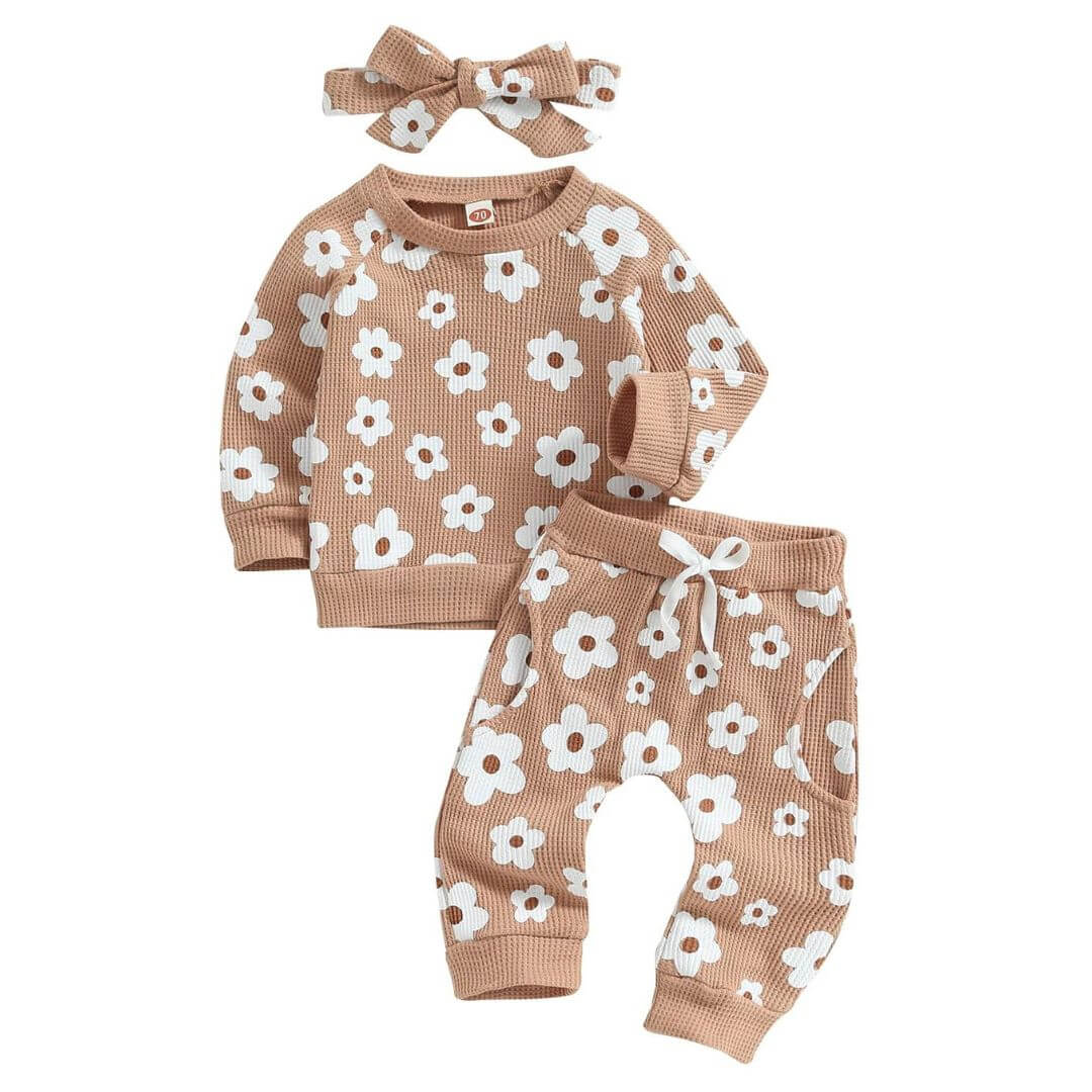 Baby girl outfit in a beige waffle fabric with floral print - includes a long sleeve top, matching harem pants and headband.