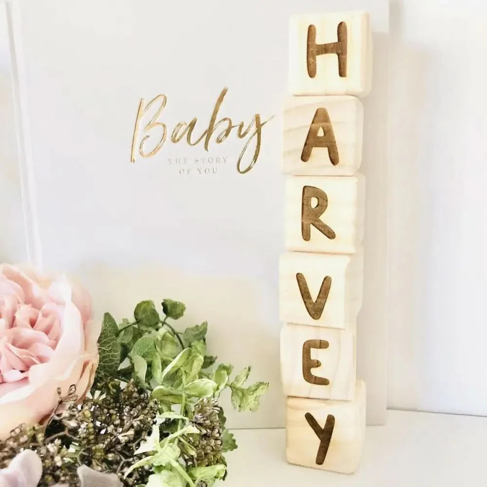 Wooden Alphabet Blocks displaying a child's name, beautifully crafted for early learning and play.
