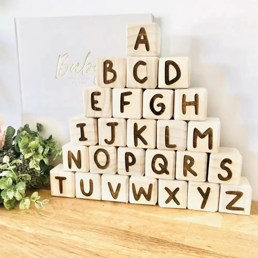 Wooden Alphabet Blocks arranged in a pyramid, encouraging early learning and creative play for children.