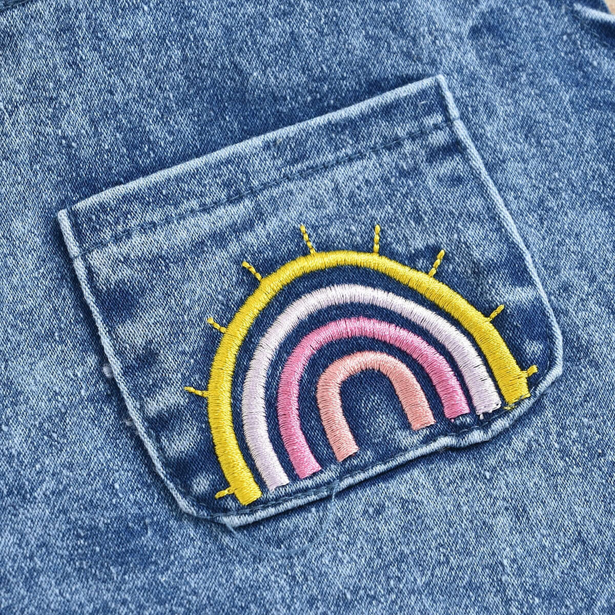 Baby Girl Denim Ruffle Rainbow Romper - closeup of rainbow embroidery on pocket - Lulu Babe