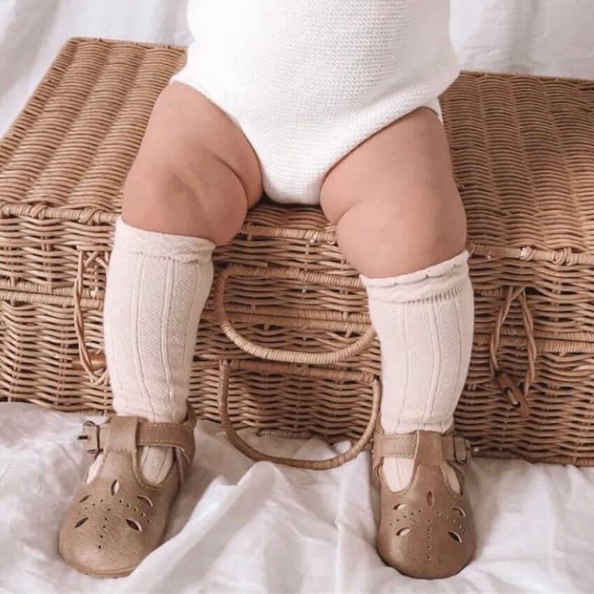 Baby wearing Morgan T-Bar Baby Shoes in beige Vegan Leather - Lulu Babe