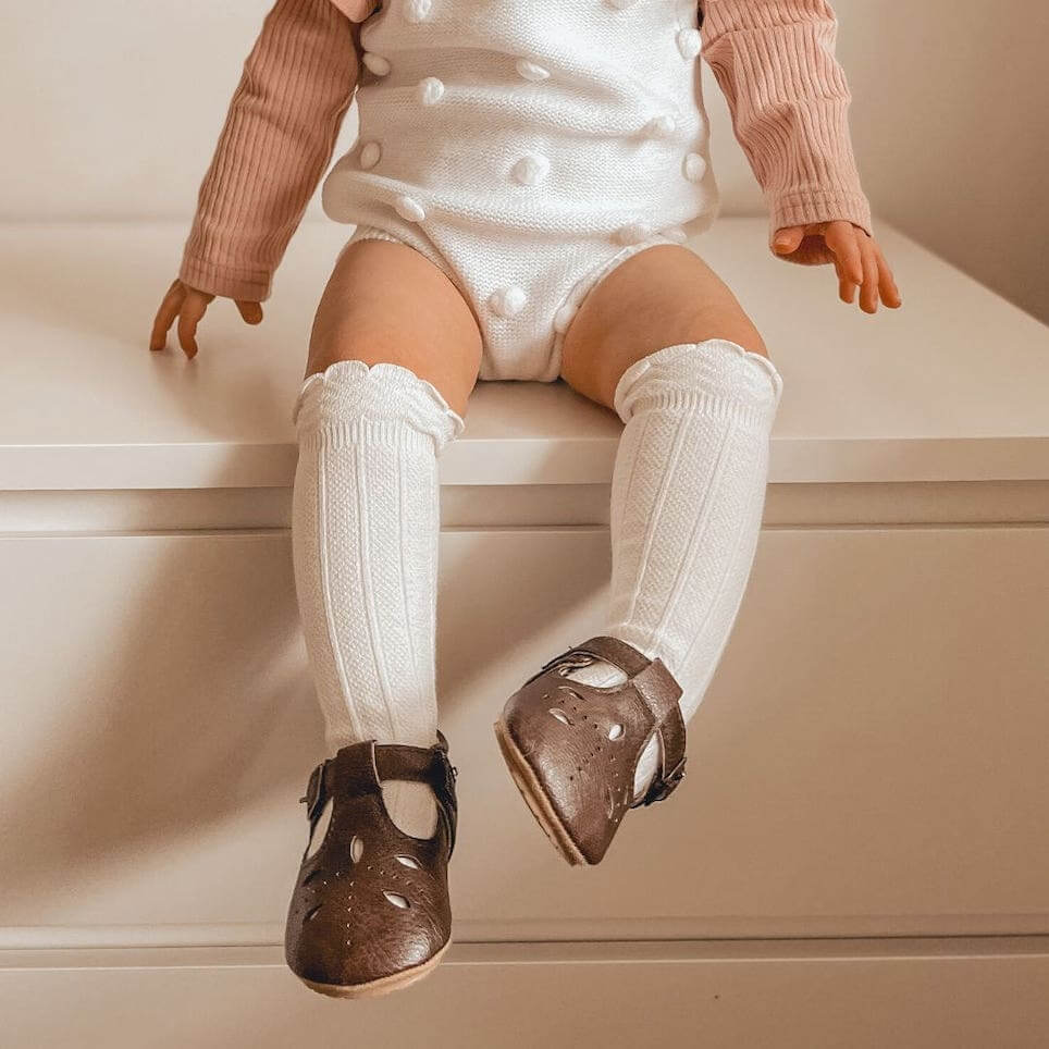 Baby wearing Morgan T-Bar Baby Shoes in chocolate brown vegan leather - Lulu Babe